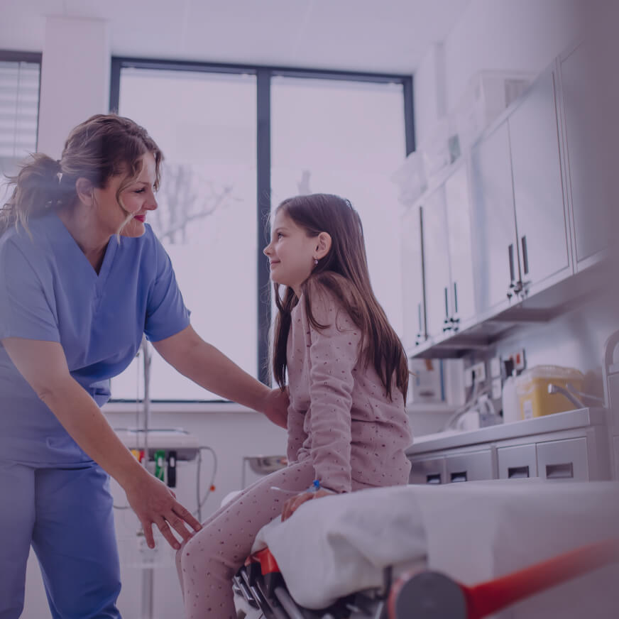 A healthcare professional meets with a young female patient at a hospital representing HonorHealth